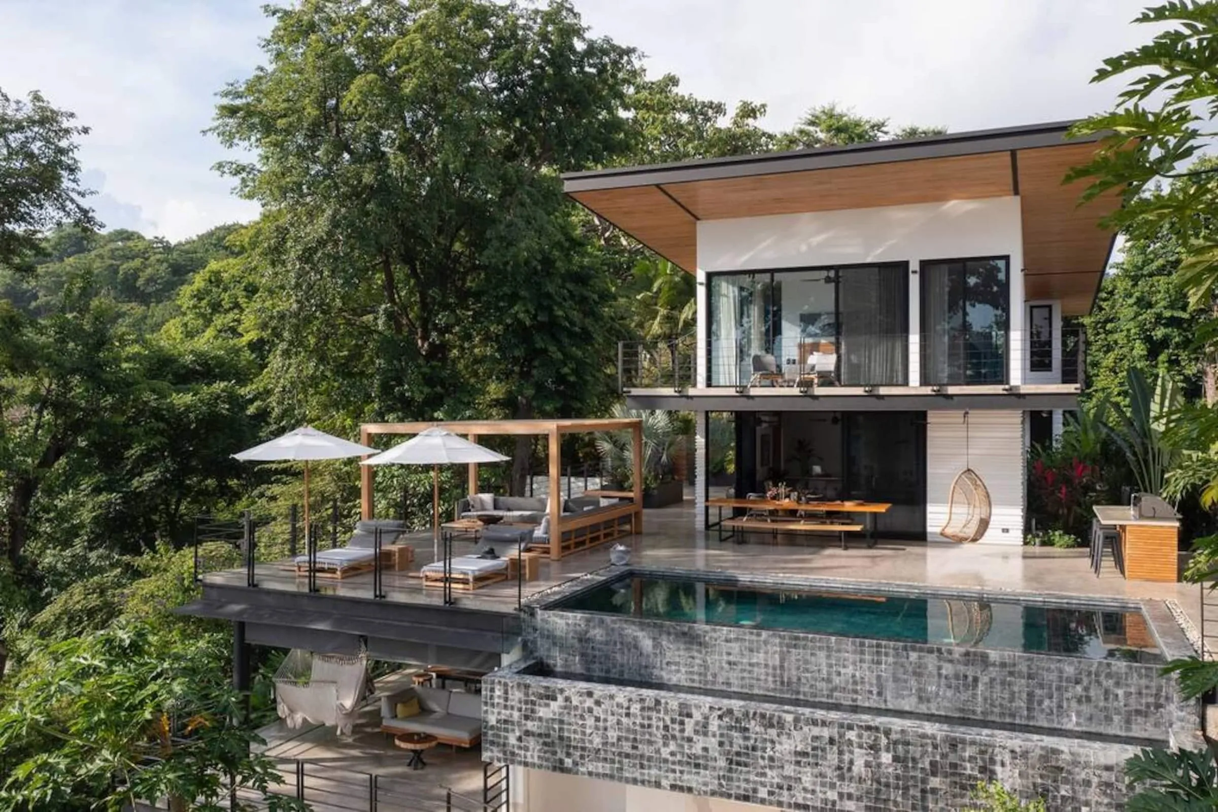 The villa and pool seen from above the hillside