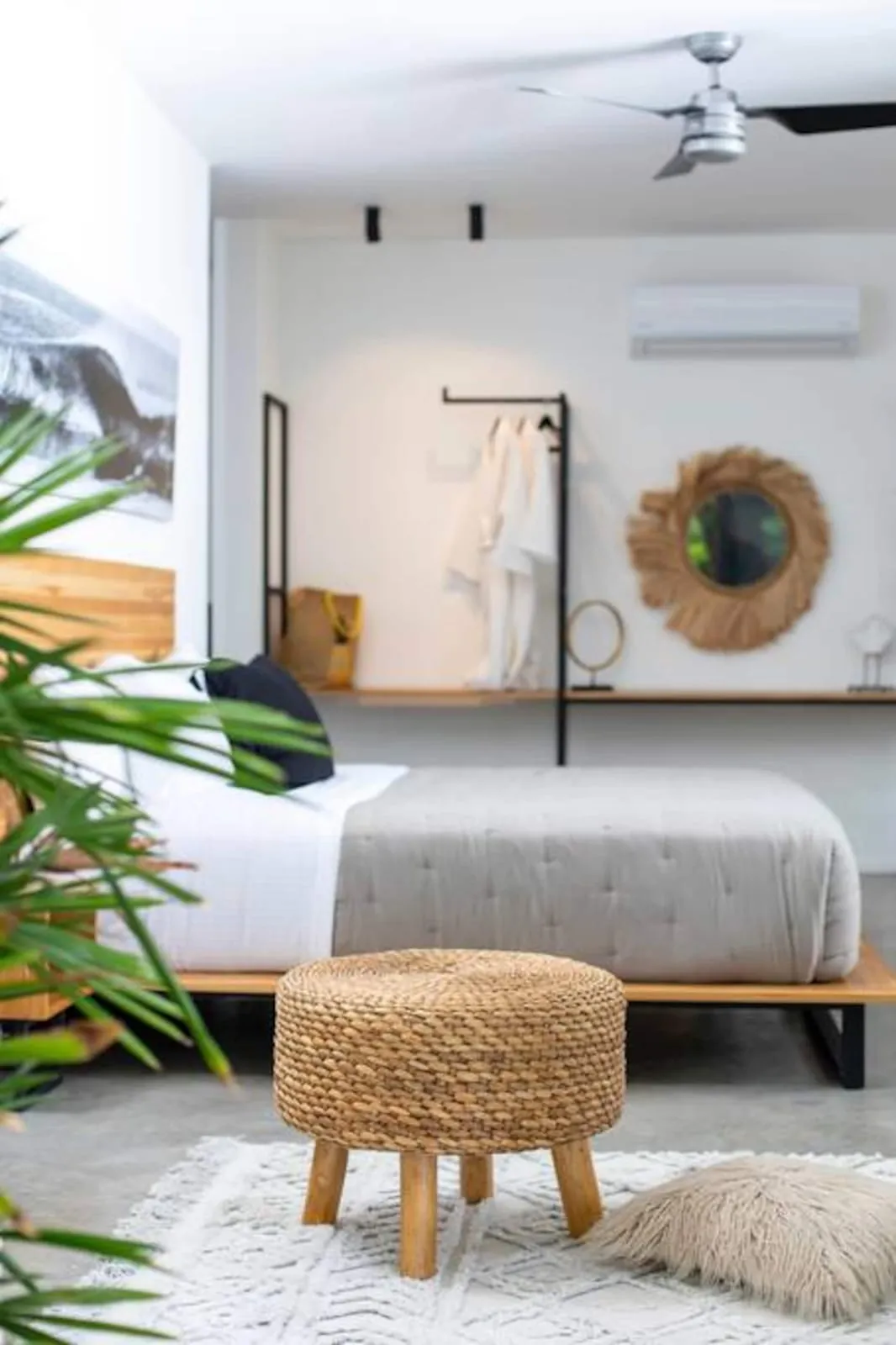 Bedroom with a round mirror