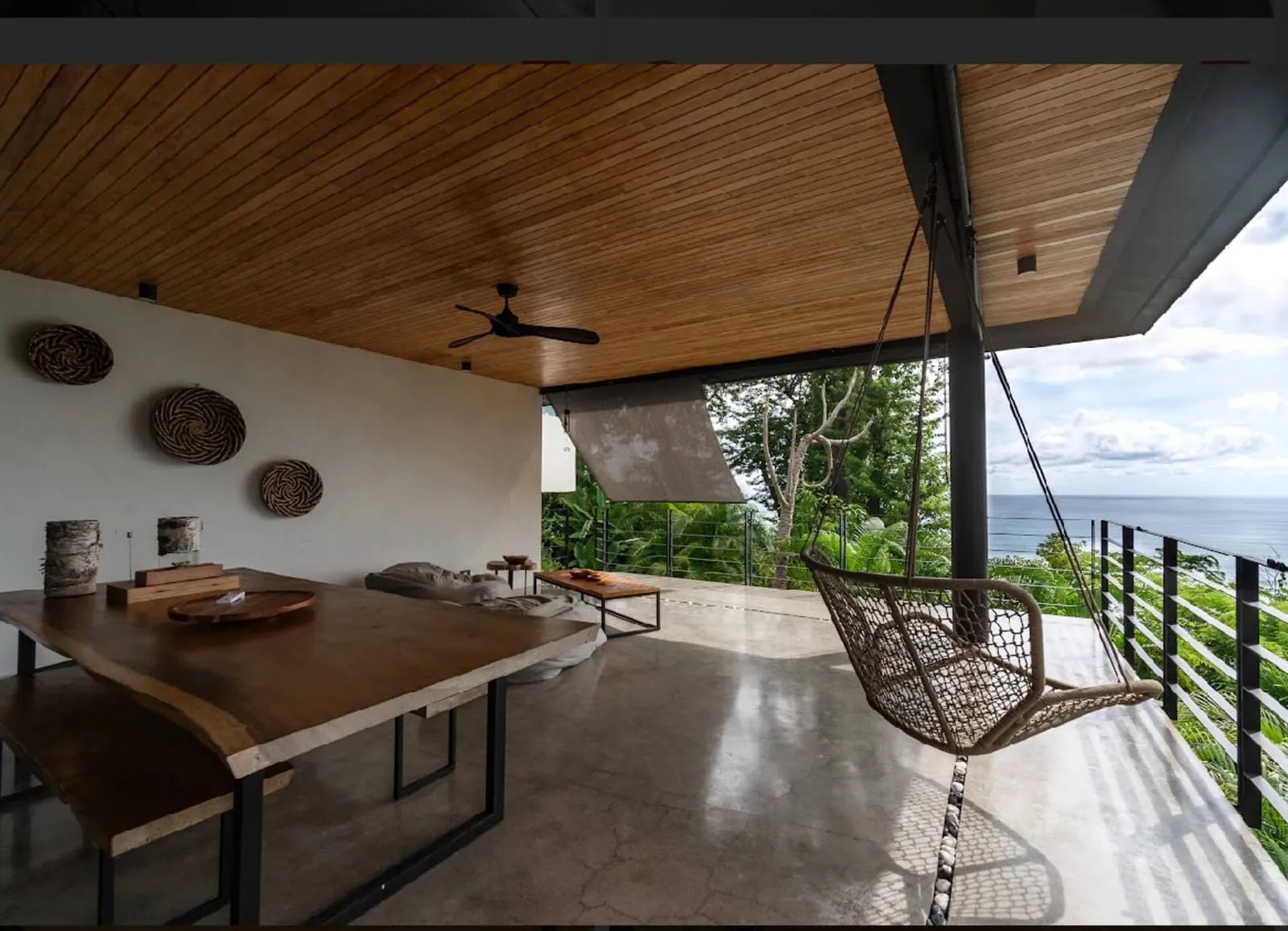 Covered terrace with a hanging chair